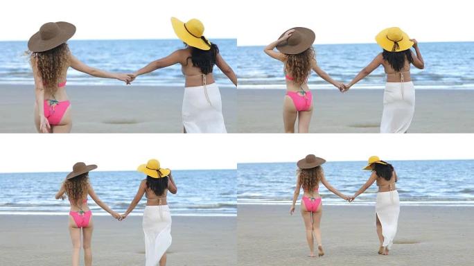 穿着比基尼的女人在夏天和朋友在海滩散步。
