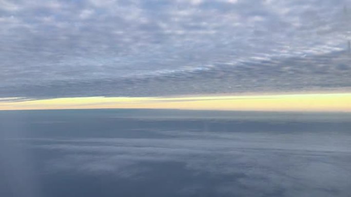 View sunset with sky and cloudy from airplane wind