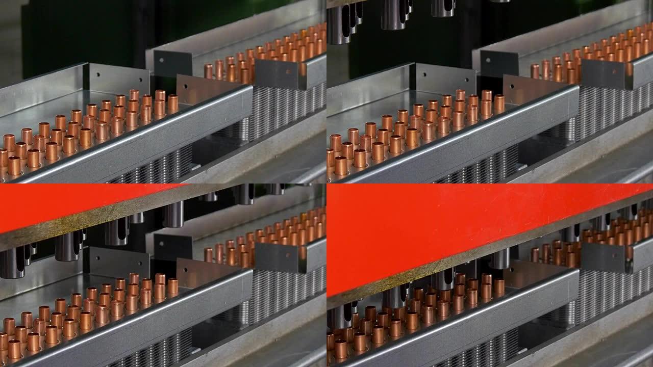 在工业数控机床上制造金属铜管。