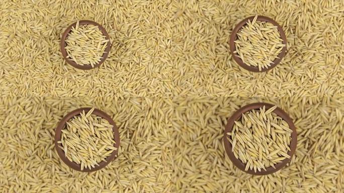 燕麦在陶罐中的旋转和接近，站在燕麦种子的背景上