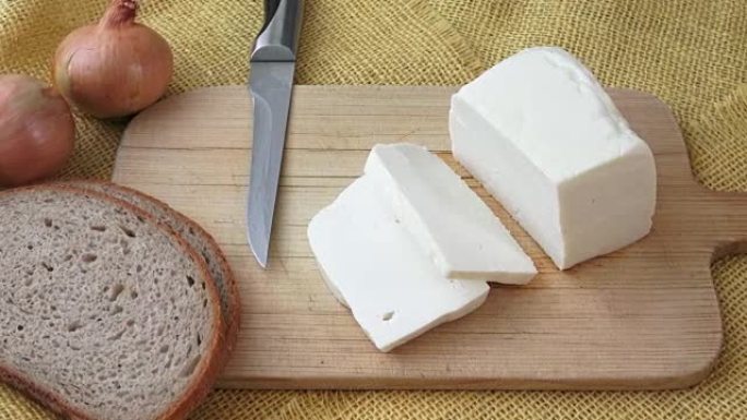 Goat cheese on a wooden cutting board