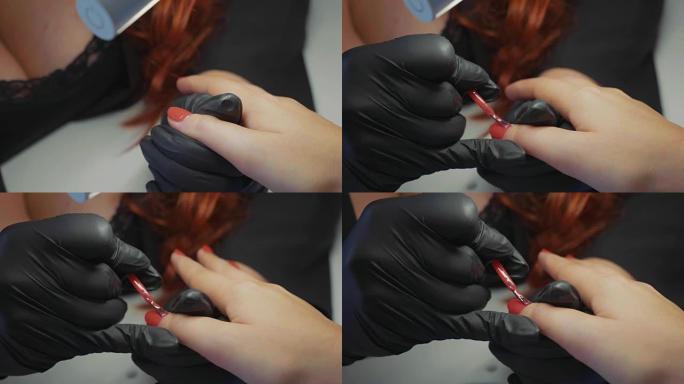 女性红色为客户的指甲做水疗程序