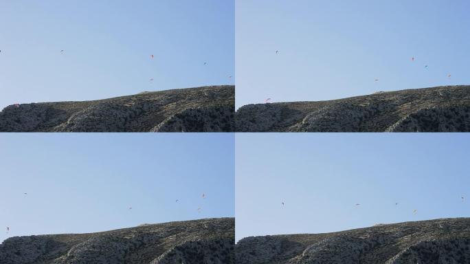 滑翔伞运动员在山上练习滑翔伞运动