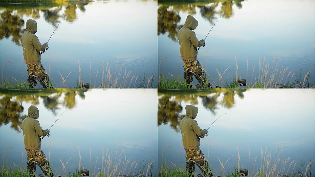 春天，鱼人在湖上钓鱼。孤独的垂钓者独自呆在大自然的包围下。他休息了