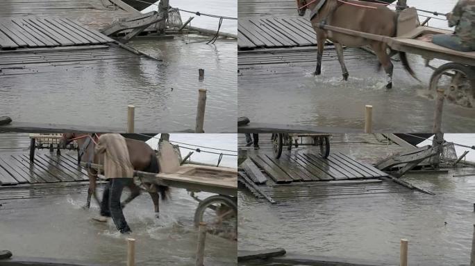 通往码头的道路被洪水淹没。马车要乘小船过河