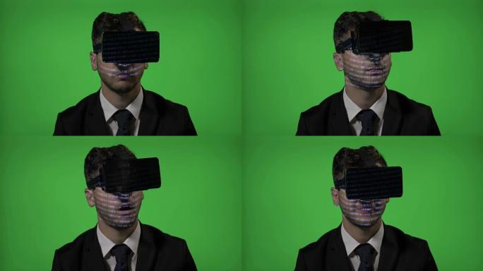 惊奇的人业务经理体验VR虚拟现实护目镜眼镜在绿屏上阅读计算机编程代码