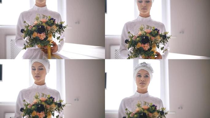 美丽的穆斯林新娘手里拿着一束鲜花