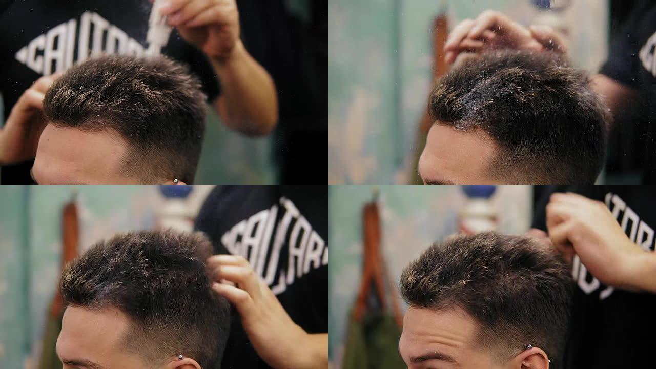 理发店的理发师在他的顾客头上涂粉末的特写视图。为客户设计时尚的专业发型