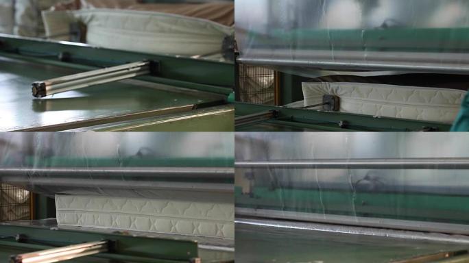 床垫单元由液压机提供并压缩，液压机将床垫压缩并包裹在玻璃纸，工厂床垫中