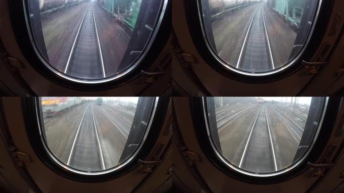 从最后移动的火车车厢或货车、枕木和铁轨的窗口观看