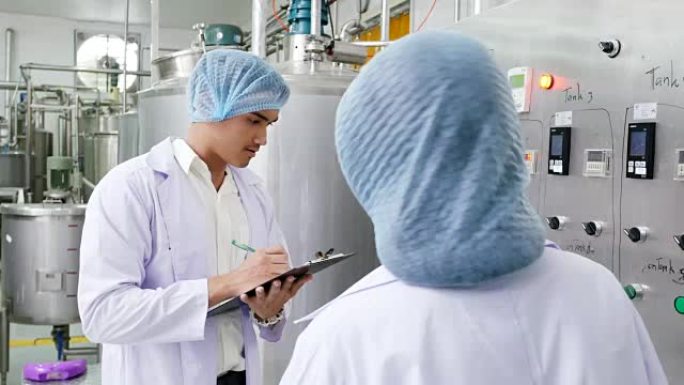 人们在工厂工作。食品生产、工业和人的概念。4k分辨率。