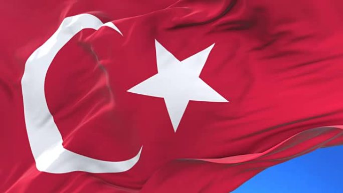 土耳其国旗在蓝色的天空中缓慢地在风中挥舞，循环