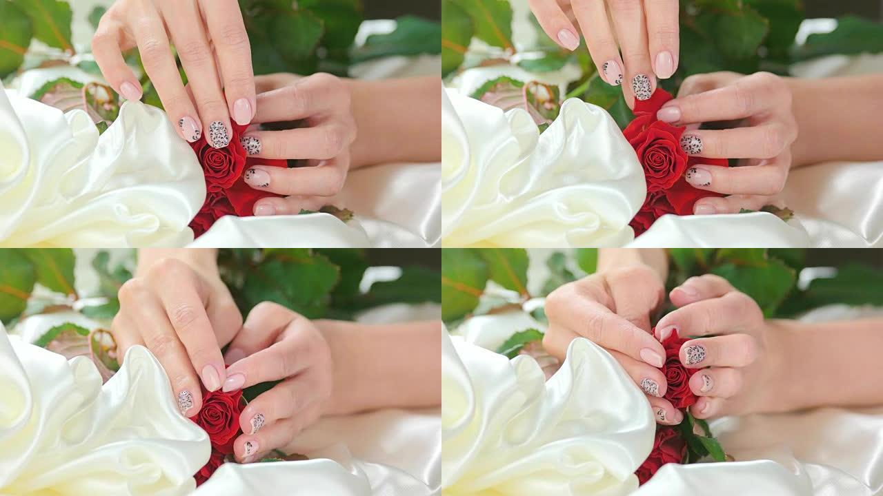 用手抚摸白丝上的玫瑰。