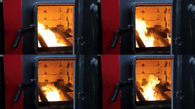 燃料在工业锅炉中燃烧。通过打开的门观看