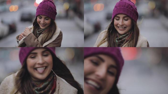 微笑的女人在冬季城市露出舌头