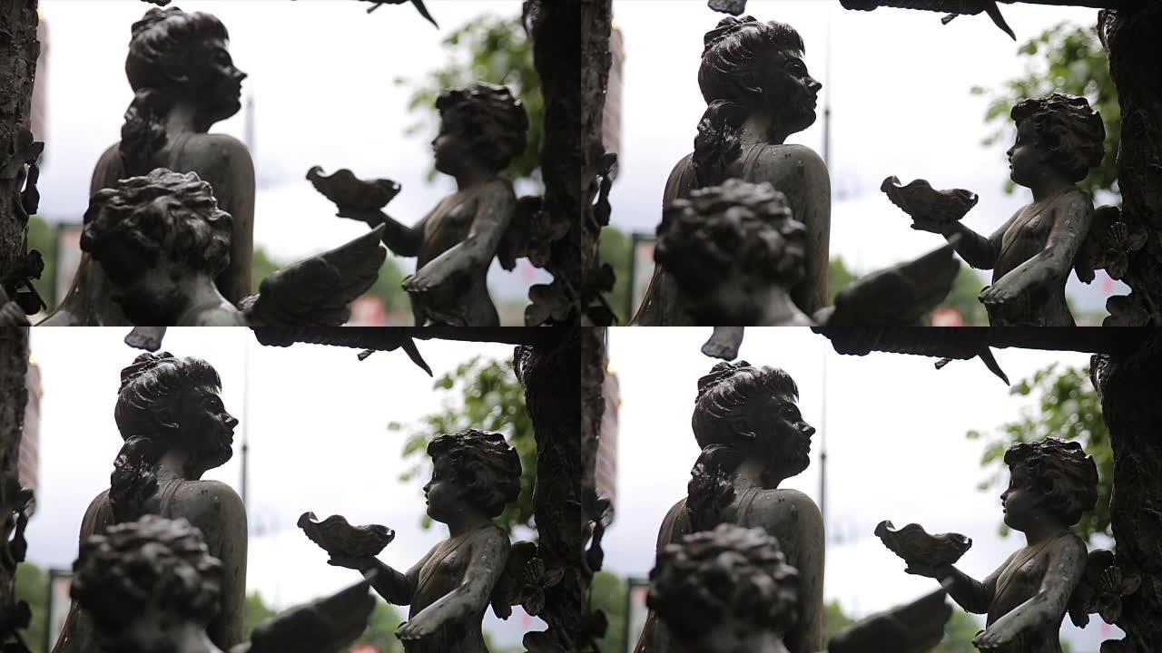 花园雕像复古特写。布宜诺斯艾利斯拉雷科莱塔公墓的睡天使。花园雕塑。丘比特雕塑。布拉格公墓的天使雕塑。