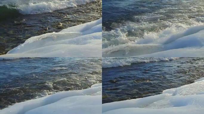 波浪在冰面上破裂在暴风雨中慢动作，相机沿着海岸的运动