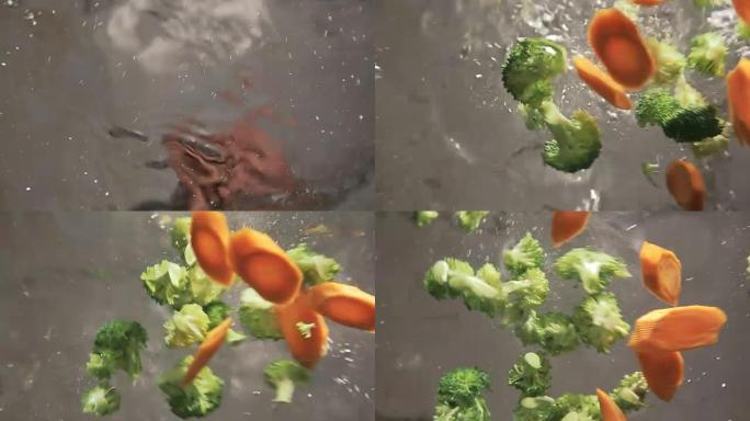 西兰花和胡萝卜倒入沸水中，慢动作