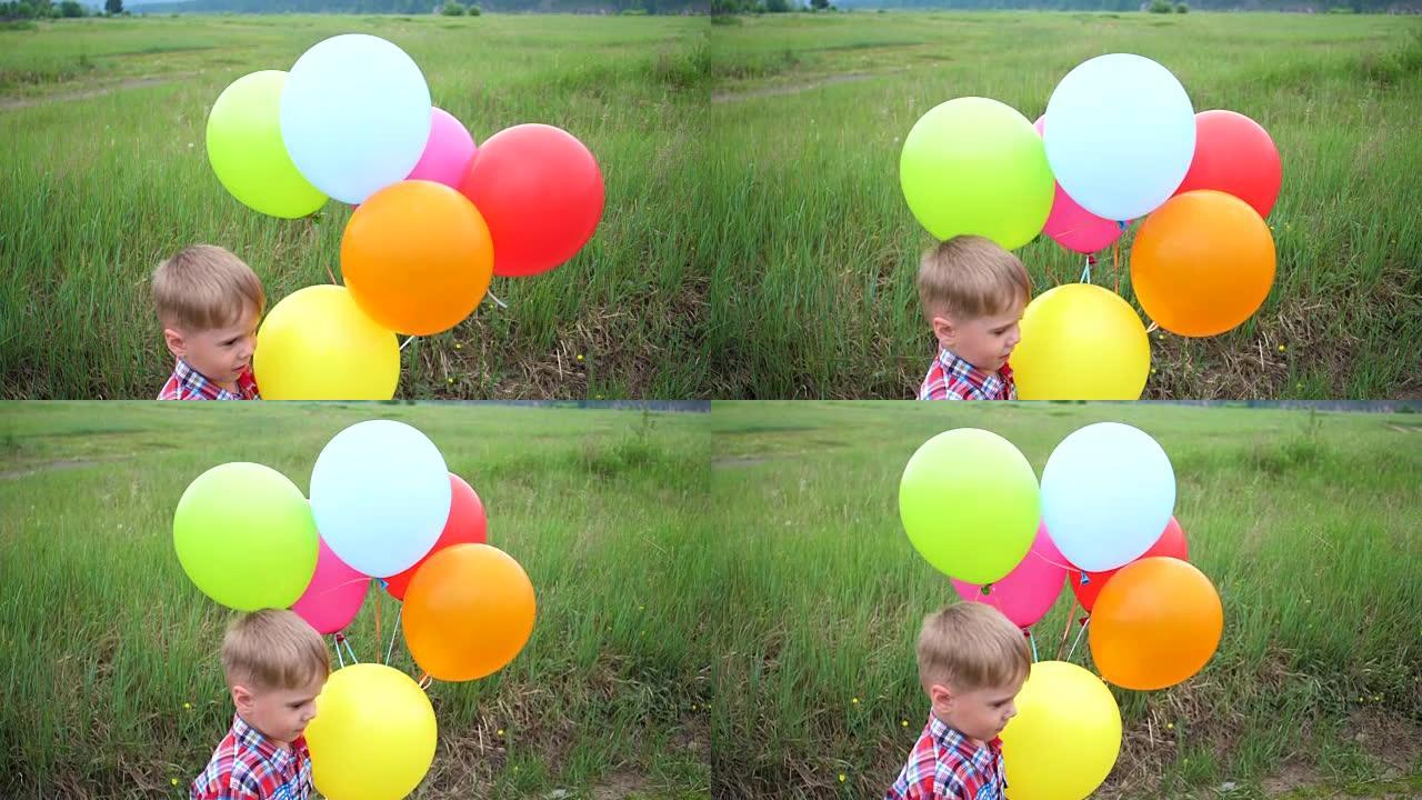 快乐的小宝贝，玩气球的乐趣。户外娱乐。庆祝和乐趣。