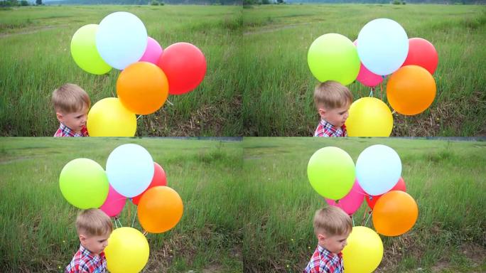 快乐的小宝贝，玩气球的乐趣。户外娱乐。庆祝和乐趣。