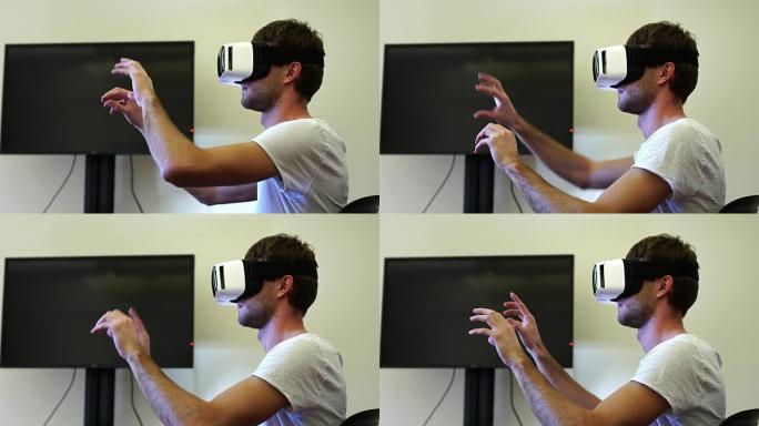 办公室里戴着虚拟现实谷歌/虚拟现实眼镜的年轻商人