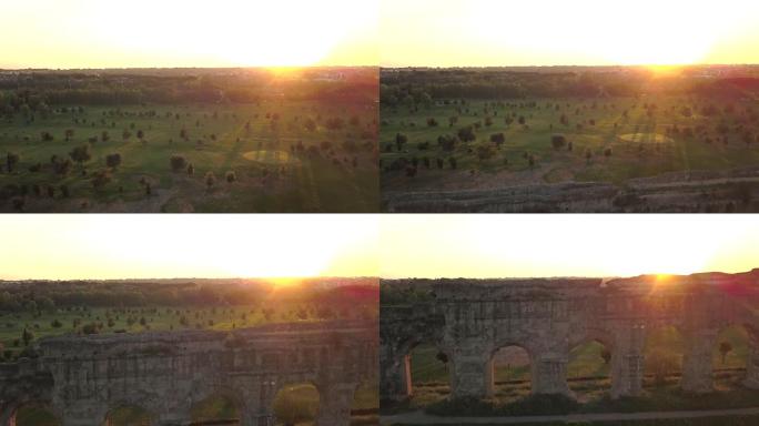 从上面看视频。日落时分，罗马渡槽的古老遗迹鸟瞰图被绿色公园包围，人们在那里跑步或度过周末。Parco