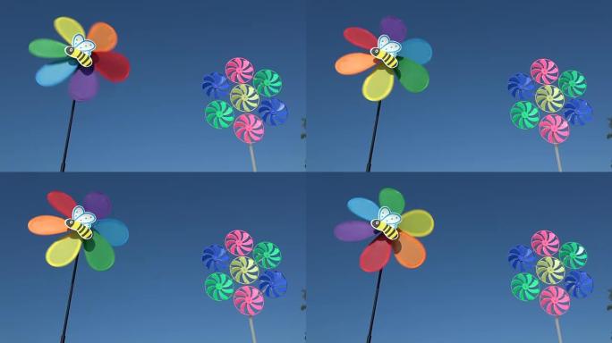天空背景上的两个装饰风车玩具