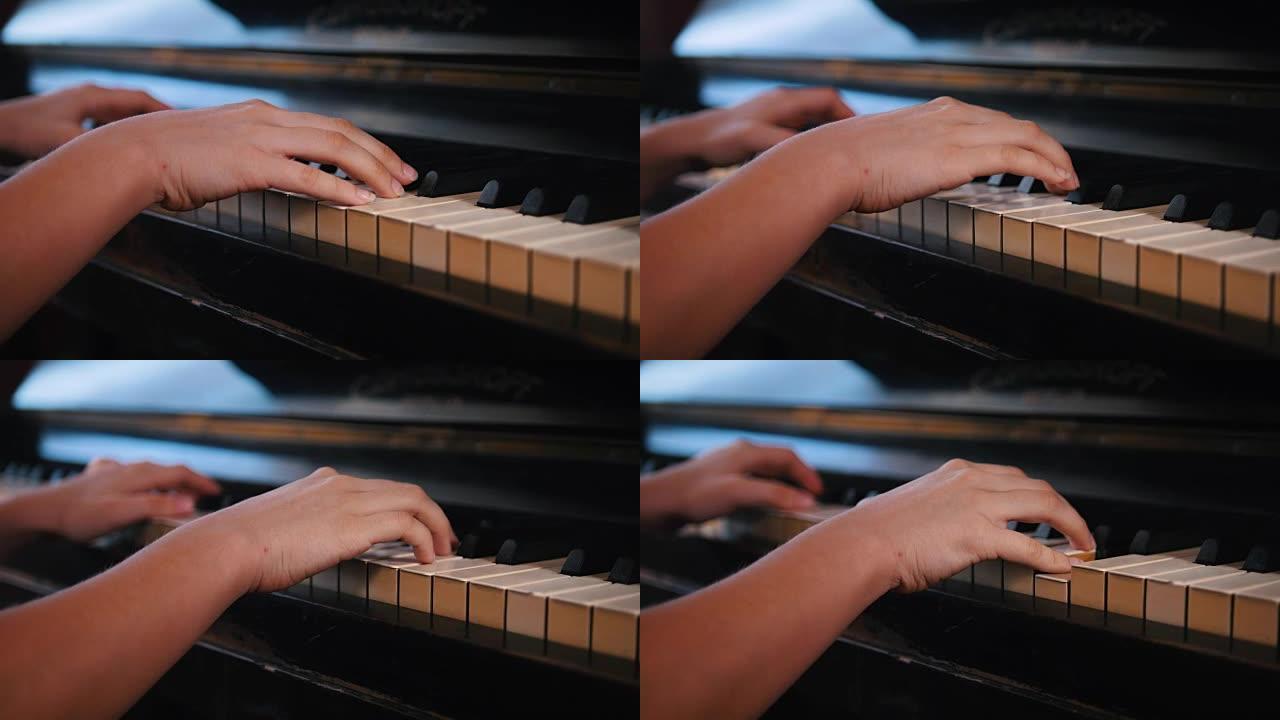 在钢琴上弹奏少女的手