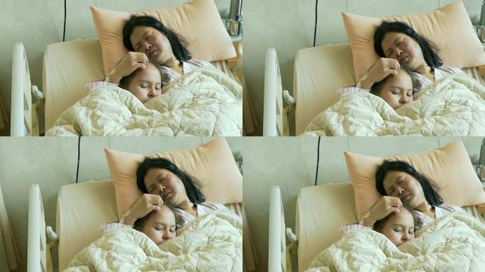与生病的母亲在医院病床上的Tween女孩