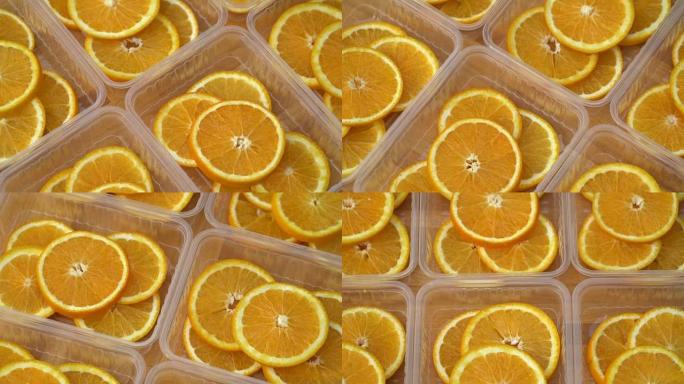 旋转新鲜的柑橘子水果。无缝循环旋转切片橙子