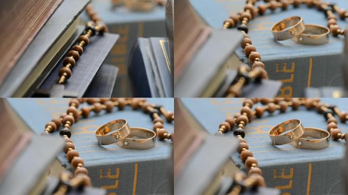 两枚结婚戒指在书架上，放大，用滑块拍摄