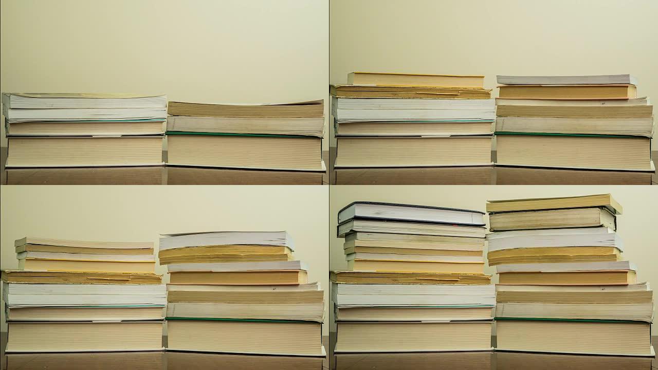 深色木制背景上堆放的书。阅读概念。时间流逝。加速逐帧拍摄