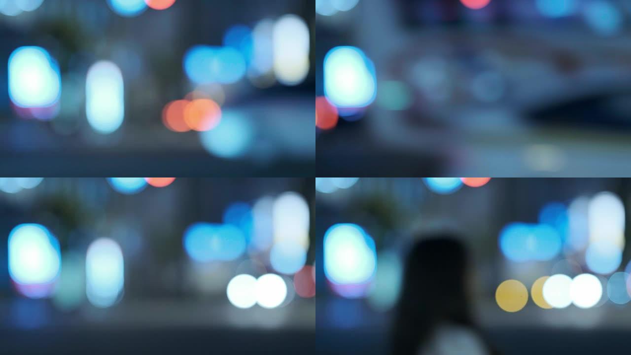 4k冷色调散焦城市夜景视频，交通和路人