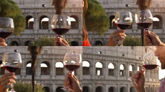 浪漫的情侣在日落时坐在罗马罗马斗兽场前的餐厅餐桌旁喝酒和敬酒