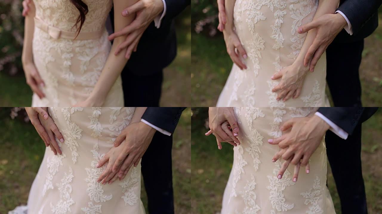 男人的手抚摸女人的手，特写。