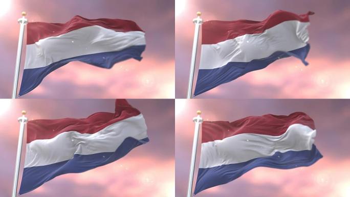 荷兰国旗在日落时以缓慢的循环在风中挥舞