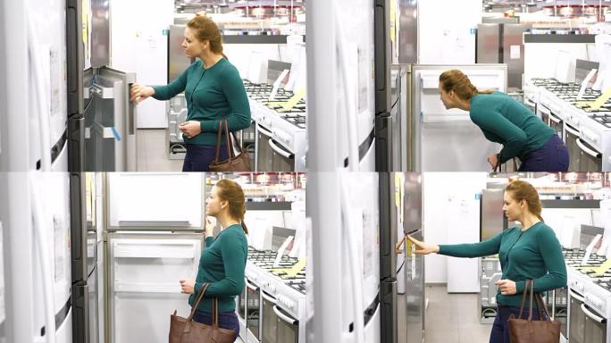 一位女士在商店里买了一台冰箱。4 k UHD。