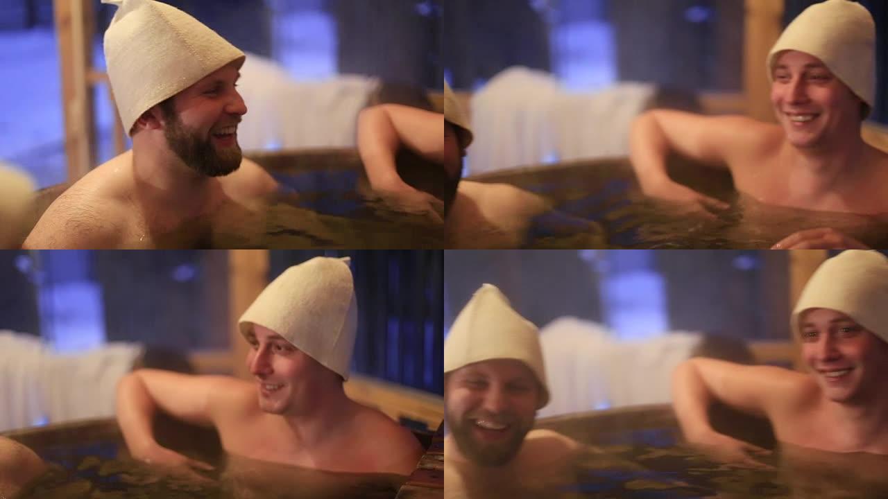 微笑快乐的男人在户外冬季热水浴缸洗澡