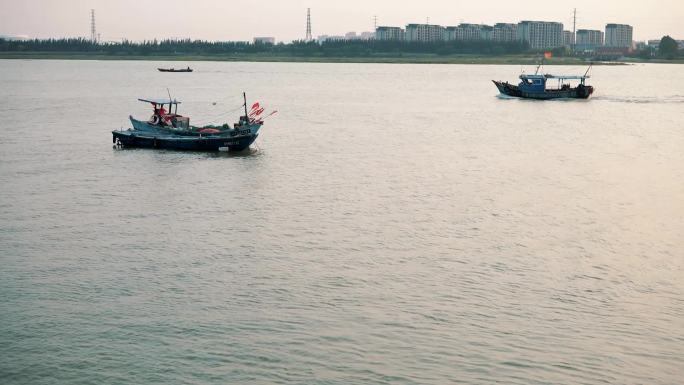 浔埔海边落日海边渔船浔埔风景