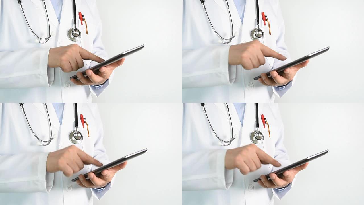 医生在医院使用平板电脑浏览信息