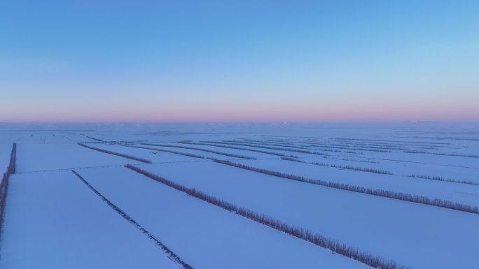 航拍4K东北垦区田野雪景暮色