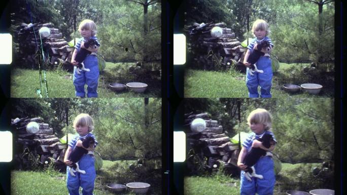 8毫米胖乎乎的金发男孩抱着小狗。扫描高清