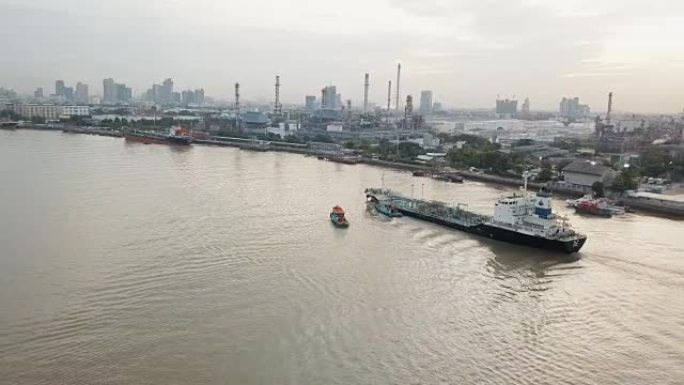 河附近集装箱船和炼油厂的鸟瞰图