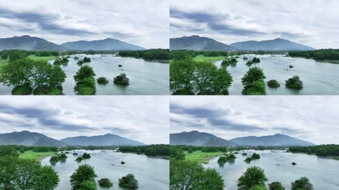 春天阳光下漓江上的竹筏和远山