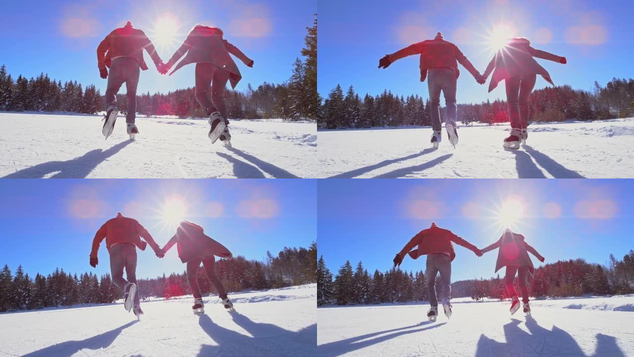 SLO MO TS男人和女人在阳光下的冰冻湖上牵手滑冰