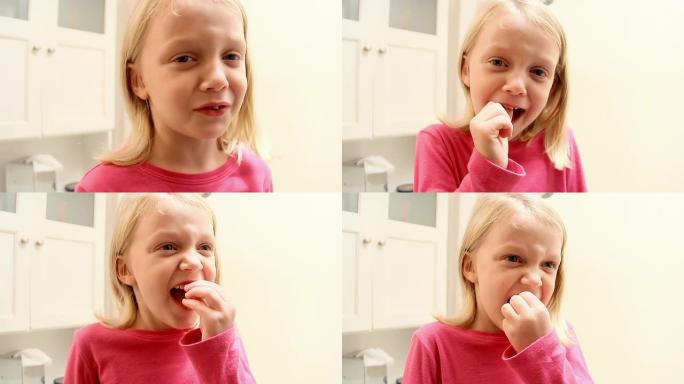 小女孩扭动牙齿