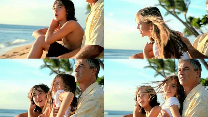 父亲在海滩上和他的孩子说话。