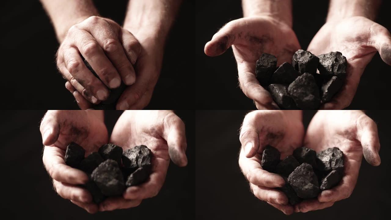 一名矿工展示他手中的煤块。