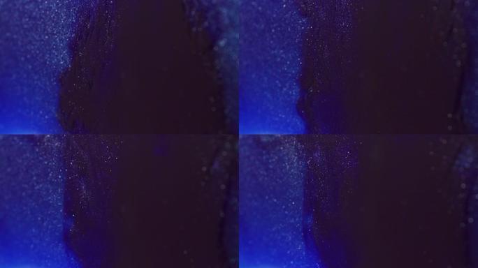 蓝色闪光粒子像深暗的海洋背景一样漂浮起来