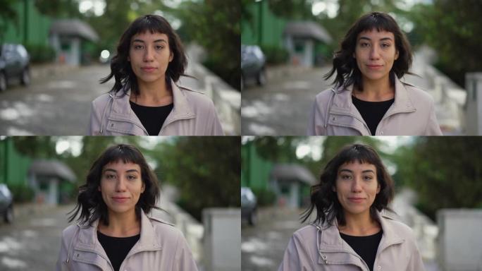 一位南美拉丁优雅的年轻女子在街上向前走。人向前走向相机